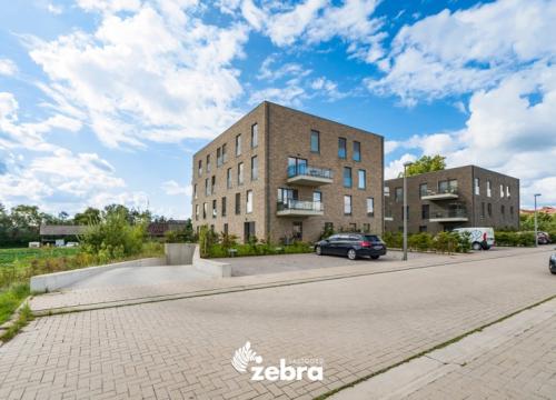 Recent nieuwbouwappartement in groene omgeving te Heule met twee staanplaatsen