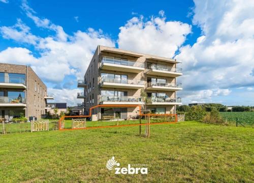 Recent nieuwbouwappartement in groene omgeving te Heule met twee staanplaatsen